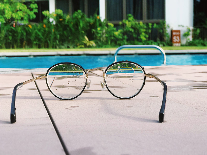 Glasses by a pool